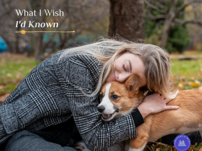 Woman cuddling with corgi dog outdoors representing pet business lessons and learning experience