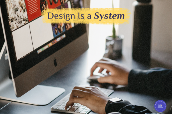 A person working at a desk using a desktop computer and keyboard while reviewing a website layout on screen, illustrating system based web design and user journey thinking for pet businesses