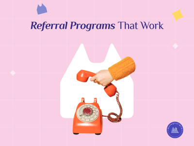 Vintage orange telephone with handset off hook representing referral programs and word of mouth marketing for pet businesses